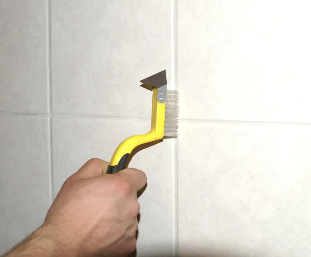 Joint knife with double-sided cutting blade and cleaning brush